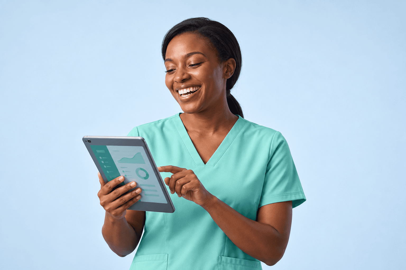 Smiling healthcare worker in mint scrubs using a care app on a tablet against a pale blue background
